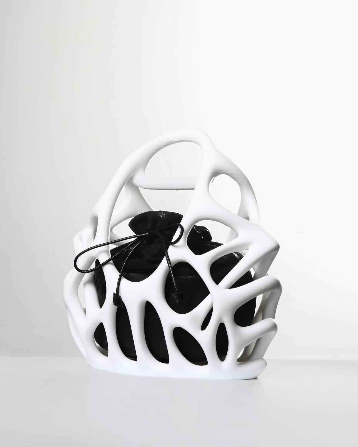 White and black geometric vase on a white background