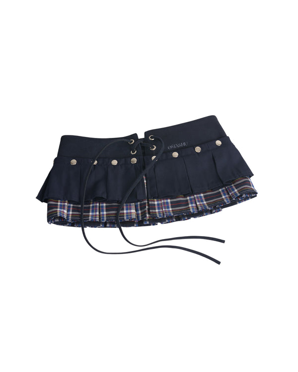 Navy blue skirt with plaid pattern and silver buttons on a white background